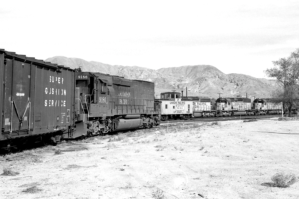 SP 9186 is a class EMD SD45T-2 and  is pictured in Yermo, California, USA.  This was taken along the Las Vegas/UP on the Southern Pacific Transportation Company. Photo Copyright: Rick Doughty uploaded to Railroad Gallery on 01/22/2024. This photograph of SP 9186 was taken on Saturday, November 29, 1980. All Rights Reserved. 