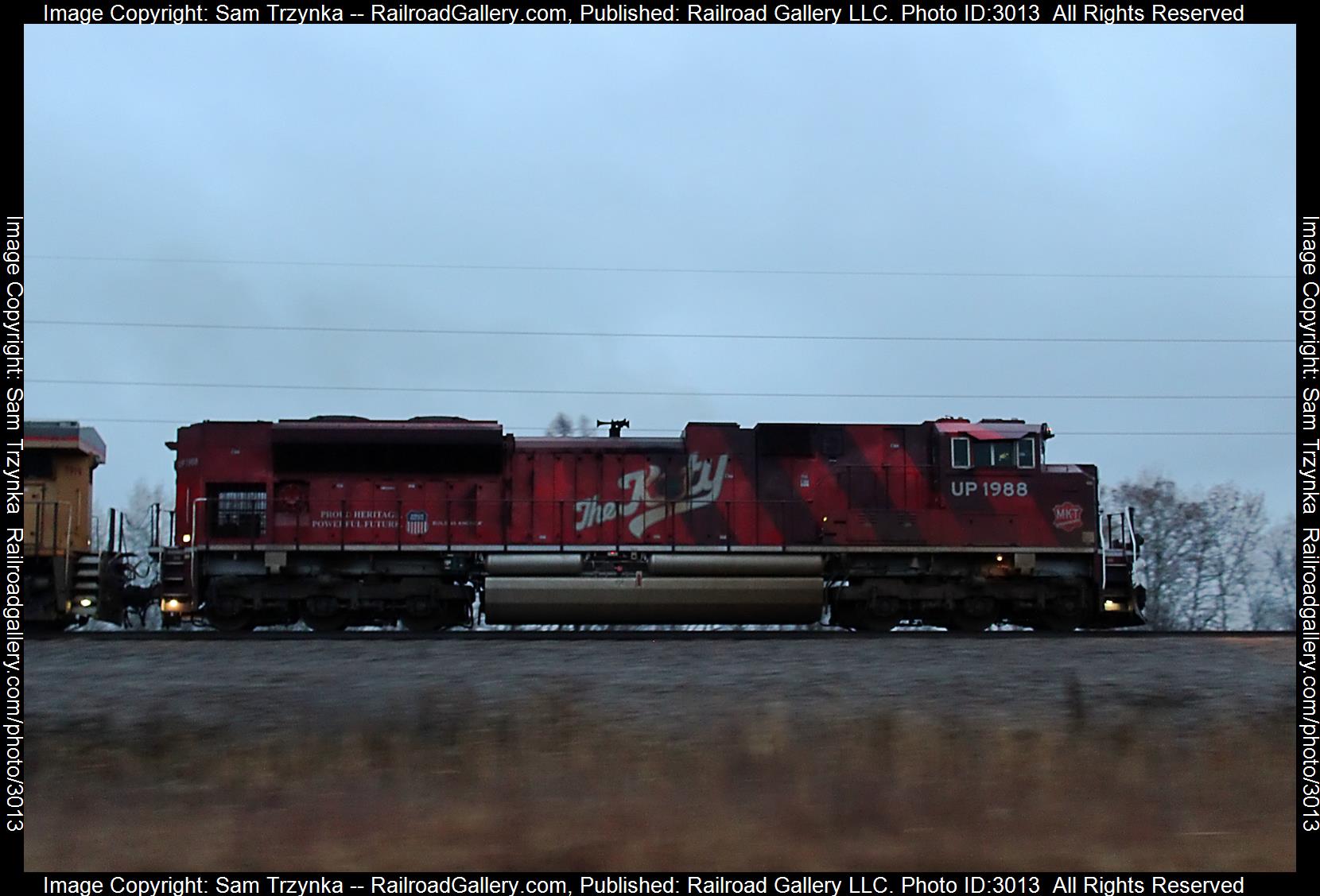 UP 1988 is a class EMD SD70ACe and  is pictured in Cambridge, Minnesota, USA.  This was taken along the BNSF Hinckley Subdivision on the Union Pacific Railroad. Photo Copyright: Sam Trzynka uploaded to Railroad Gallery on 01/22/2024. This photograph of UP 1988 was taken on Tuesday, December 26, 2023. All Rights Reserved. 