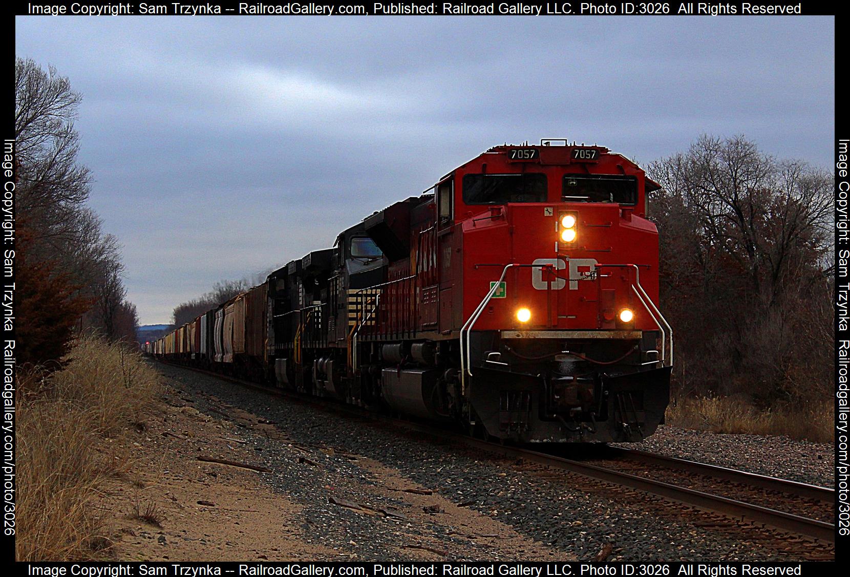 CP 7057 is a class EMD SD70ACU and  is pictured in Welch Twp, Minnesota, USA.  This was taken along the CP River Subdivision on the CPKC Railway. Photo Copyright: Sam Trzynka uploaded to Railroad Gallery on 01/26/2024. This photograph of CP 7057 was taken on Thursday, December 28, 2023. All Rights Reserved. 