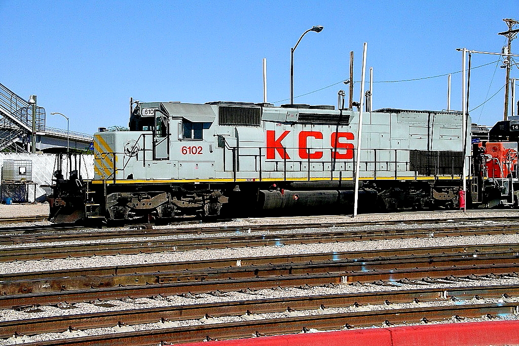 KCS 6102 is a class EMD SD40T-2 and  is pictured in Tucson, Arizona, USA.  This was taken along the Lordsburg/SP on the Kansas City Southern Railway. Photo Copyright: Rick Doughty uploaded to Railroad Gallery on 01/29/2024. This photograph of KCS 6102 was taken on Wednesday, October 06, 2004. All Rights Reserved. 