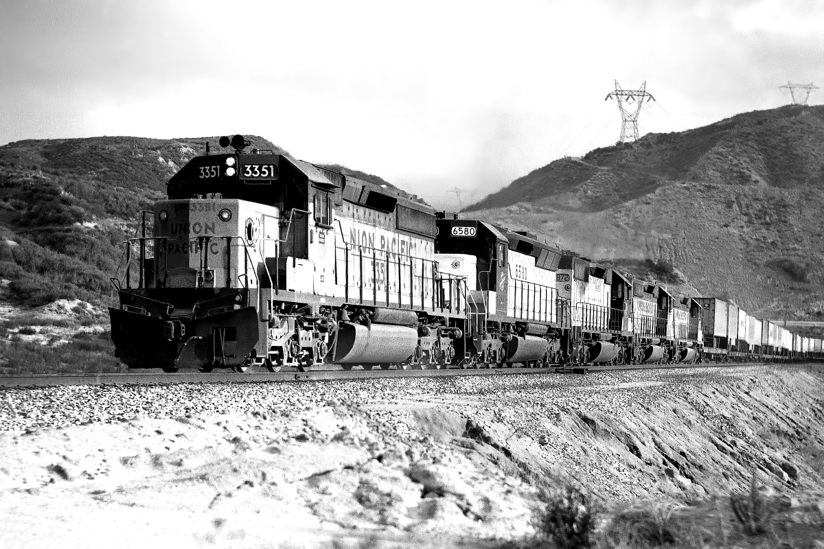 UP 3351 is a class EMD SD40-2 and  is pictured in Cajon, California, USA.  This was taken along the Cajon/UP on the Union Pacific Railroad. Photo Copyright: Rick Doughty uploaded to Railroad Gallery on 01/31/2024. This photograph of UP 3351 was taken on Saturday, November 30, 1985. All Rights Reserved. 