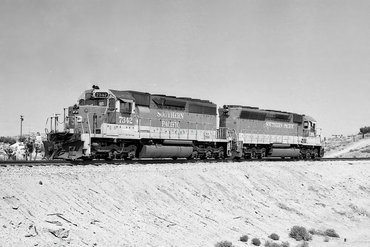 SP 7342 is a class EMD SD40 and  is pictured in Vincent, California, USA.  This was taken along the Saugus/SP on the Southern Pacific Transportation Company. Photo Copyright: Rick Doughty uploaded to Railroad Gallery on 02/03/2024. This photograph of SP 7342 was taken on Saturday, May 12, 1984. All Rights Reserved. 