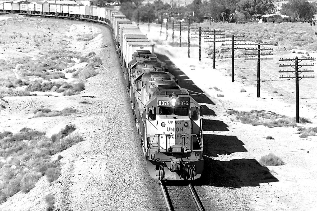 UP 8075 is a class EMD SD40-2 and  is pictured in Victorville, California, USA.  This was taken along the Cajon/UP on the Union Pacific Railroad. Photo Copyright: Rick Doughty uploaded to Railroad Gallery on 02/24/2024. This photograph of UP 8075 was taken on Monday, May 26, 1980. All Rights Reserved. 