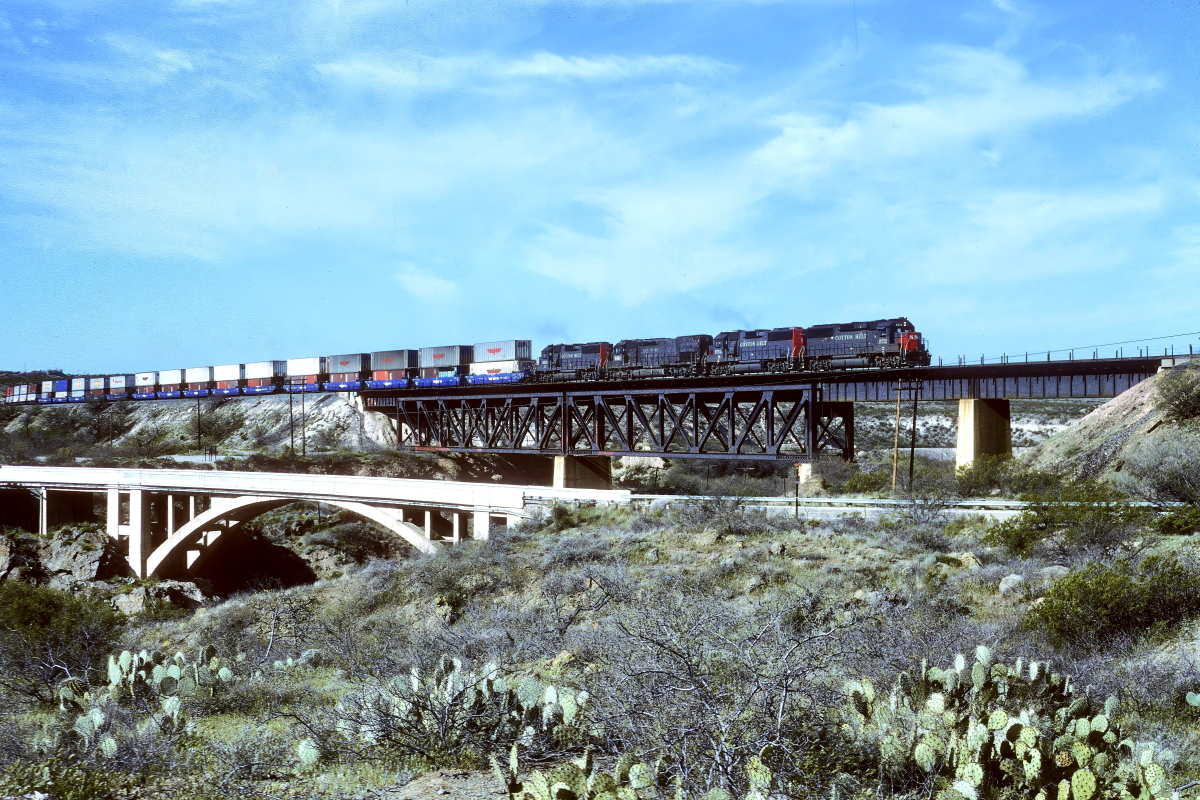 SSW 9712 is a class EMD GP60 and  is pictured in Vail, Arizona, USA.  This was taken along the Lordsburg/SP on the Southern Pacific Transportation Company. Photo Copyright: Rick Doughty uploaded to Railroad Gallery on 03/28/2024. This photograph of SSW 9712 was taken on Friday, March 17, 1995. All Rights Reserved. 