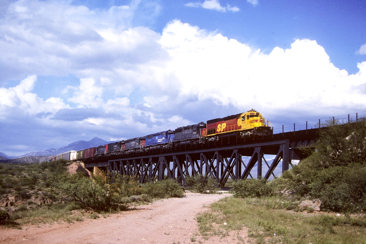 SP 8526 is a class EMD SD40T-2 and  is pictured in Vail, Arizona, USA.  This was taken along the Lordsburg/SP on the Southern Pacific Transportation Company. Photo Copyright: Rick Doughty uploaded to Railroad Gallery on 05/15/2024. This photograph of SP 8526 was taken on Saturday, September 03, 1988. All Rights Reserved. 