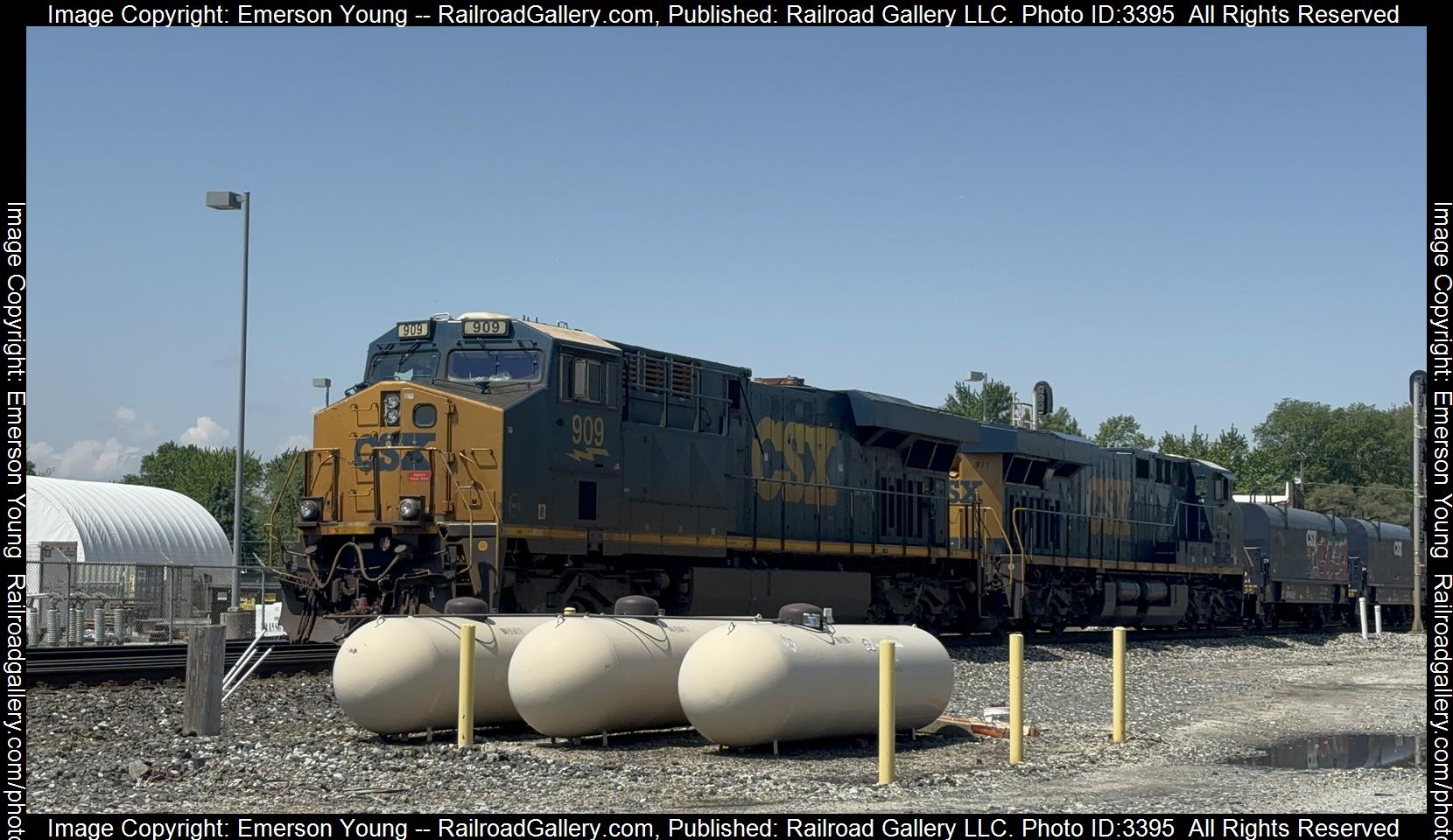 CSX 909 is a class ES44AC-H and  is pictured in Fostoria , Ohio, USA.  This was taken along the CSX Willard Subdivision  on the CSX Transportation. Photo Copyright: Emerson Young uploaded to Railroad Gallery on 05/18/2024. This photograph of CSX 909 was taken on Saturday, May 18, 2024. All Rights Reserved. 