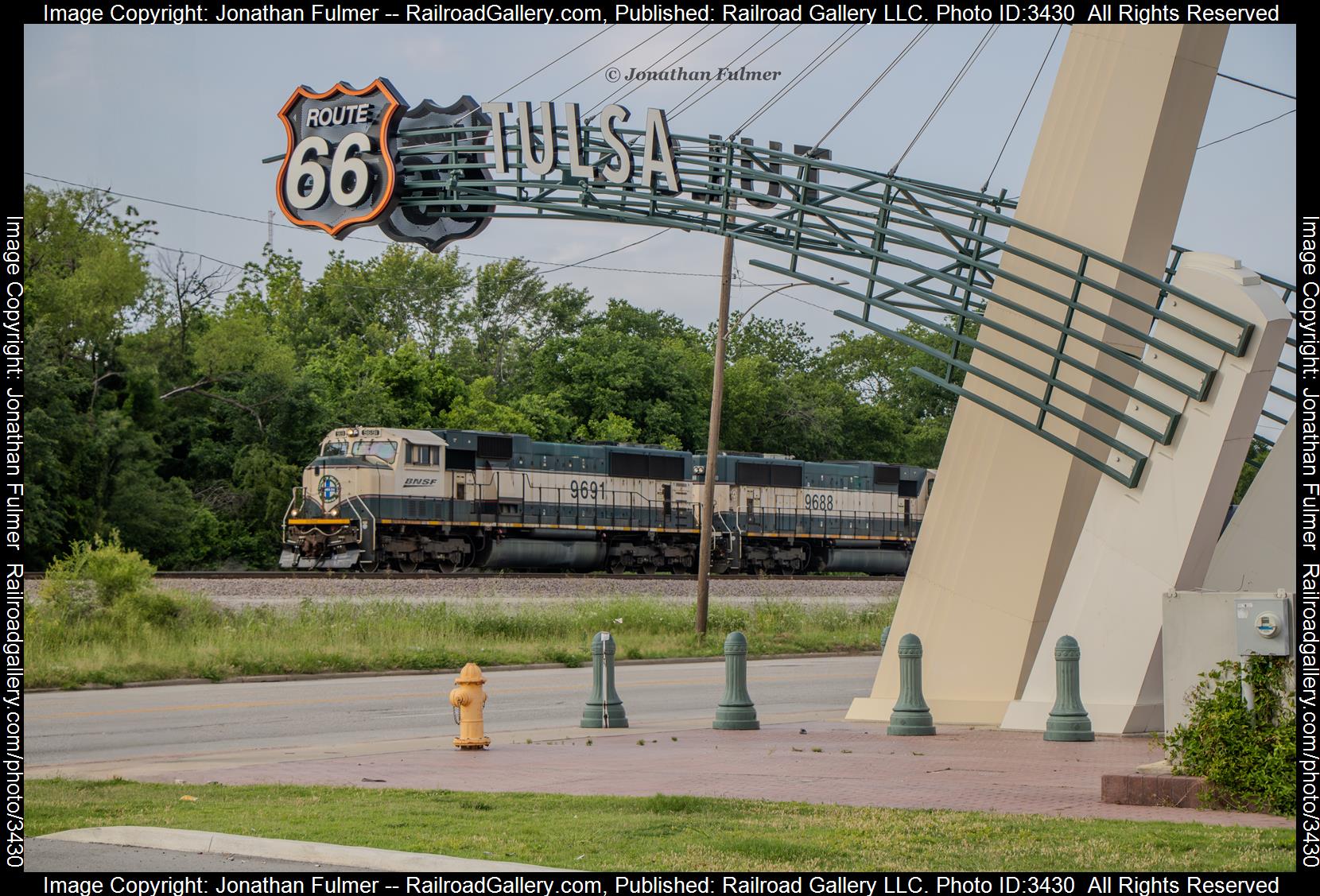 BNSF 9691, BNSF 9688 is a class EMD SD70MAC and  is pictured in Tulsa, Oklahoma, United States.  This was taken along the BNSF Creek Sub on the BNSF Railway. Photo Copyright: Jonathan Fulmer uploaded to Railroad Gallery on 05/24/2024. This photograph of BNSF 9691, BNSF 9688 was taken on Friday, May 24, 2024. All Rights Reserved. 