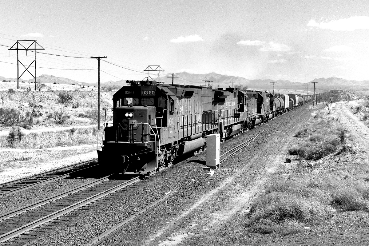 SP 9360 is a class EMD SD45T-2 and  is pictured in Mescal, Arizona, USA.  This was taken along the Lordsburg/SP on the Southern Pacific Transportation Company. Photo Copyright: Rick Doughty uploaded to Railroad Gallery on 06/10/2024. This photograph of SP 9360 was taken on Thursday, March 07, 1991. All Rights Reserved. 