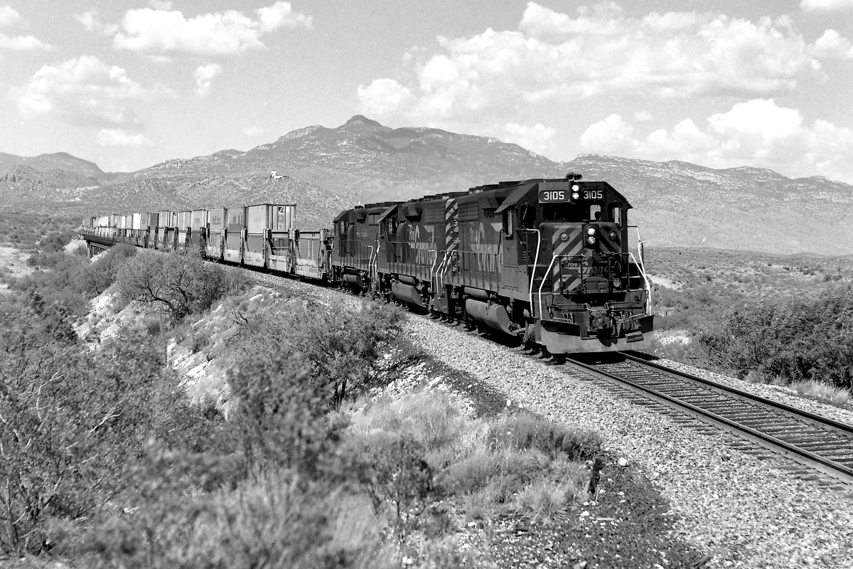 RG 3105  is a class EMD GP40-2 and  is pictured in Vail, Arizona, USA.  This was taken along the Lordsburg/SP on the Denver and Rio Grande Western Railroad. Photo Copyright: Rick Doughty uploaded to Railroad Gallery on 06/10/2024. This photograph of RG 3105  was taken on Sunday, June 02, 1991. All Rights Reserved. 