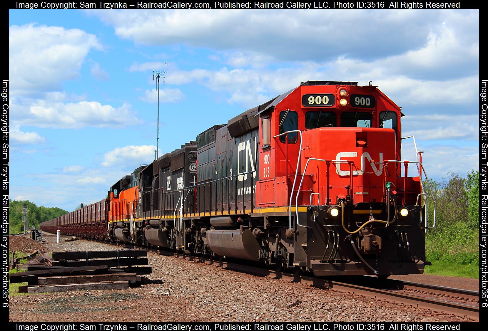 BLE 900 is a class EMD SD40-3 and  is pictured in Alborn, Minnesota, USA.  This was taken along the CN Missabe Subdivision on the Canadian National Railway. Photo Copyright: Sam Trzynka uploaded to Railroad Gallery on 06/15/2024. This photograph of BLE 900 was taken on Friday, June 07, 2024. All Rights Reserved. 