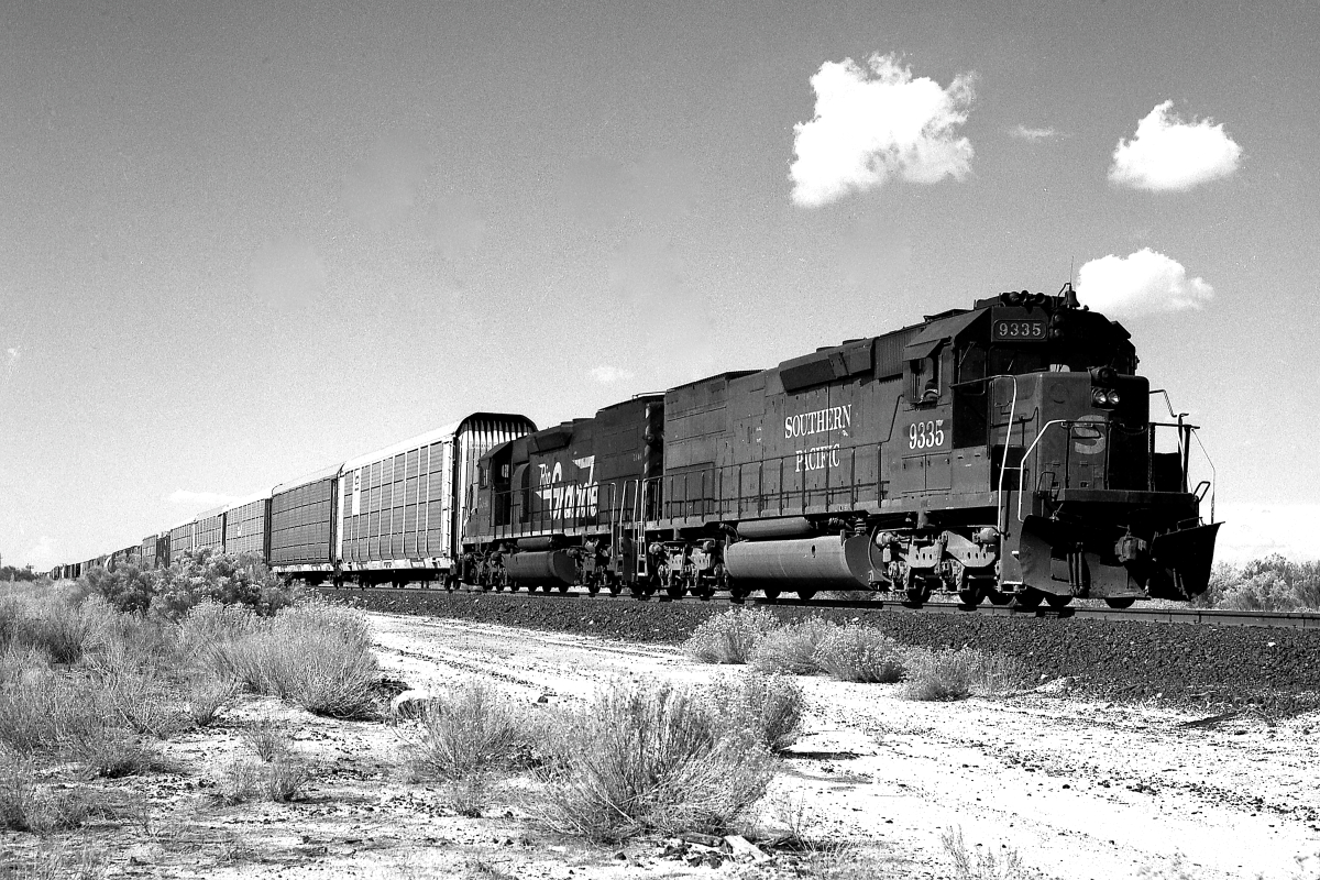 SP 9335 is a class EMD SD45T-2 and  is pictured in Tucson, Arizona, USA.  This was taken along the Yuma/SP on the Southern Pacific Transportation Company. Photo Copyright: Rick Doughty uploaded to Railroad Gallery on 06/21/2024. This photograph of SP 9335 was taken on Wednesday, August 26, 1987. All Rights Reserved. 