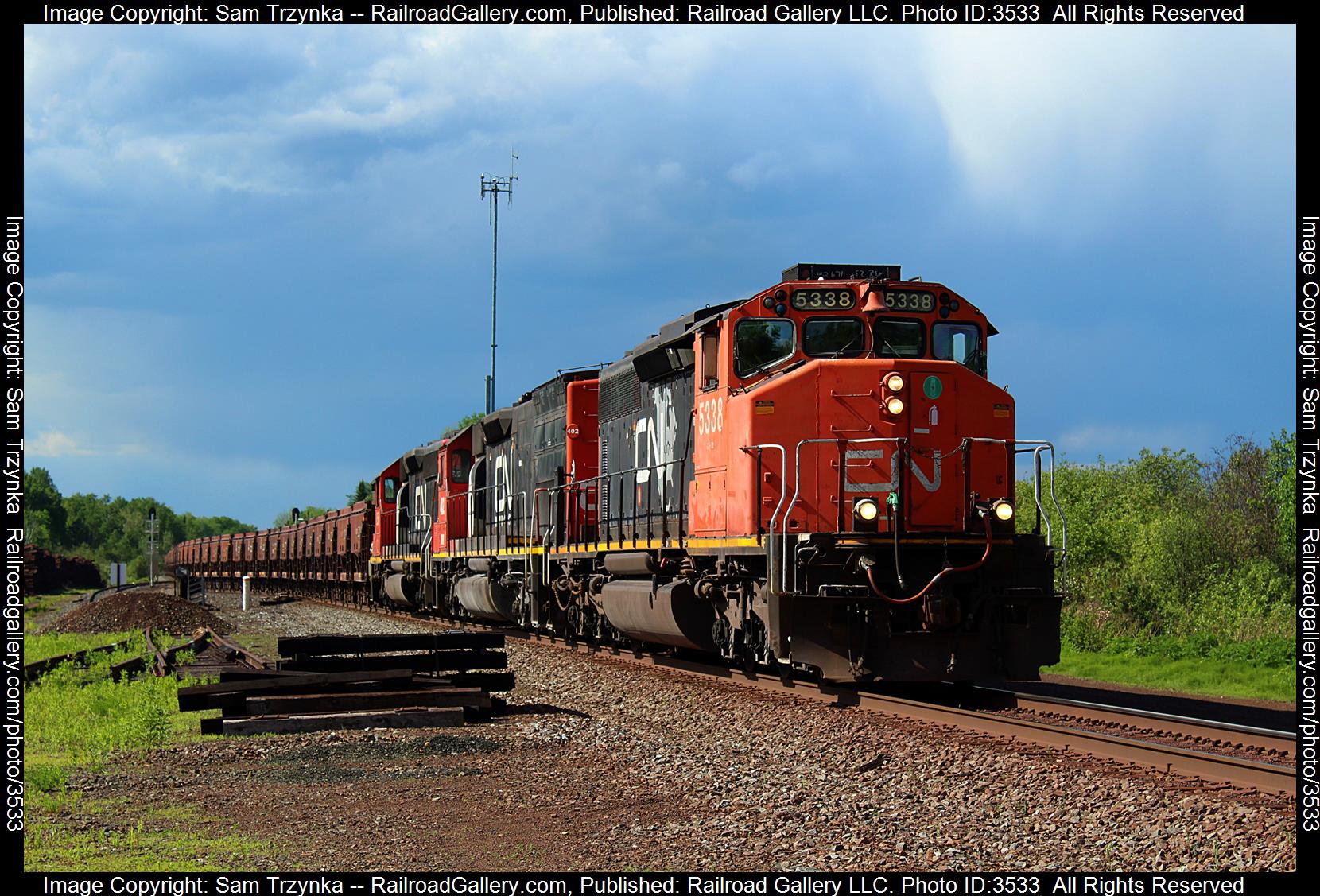 CN 5338 is a class EMD SD40-2W and  is pictured in Alborn, Minnesota, USA.  This was taken along the CN Missabe Subdivision on the Canadian National Railway. Photo Copyright: Sam Trzynka uploaded to Railroad Gallery on 06/23/2024. This photograph of CN 5338 was taken on Saturday, June 08, 2024. All Rights Reserved. 