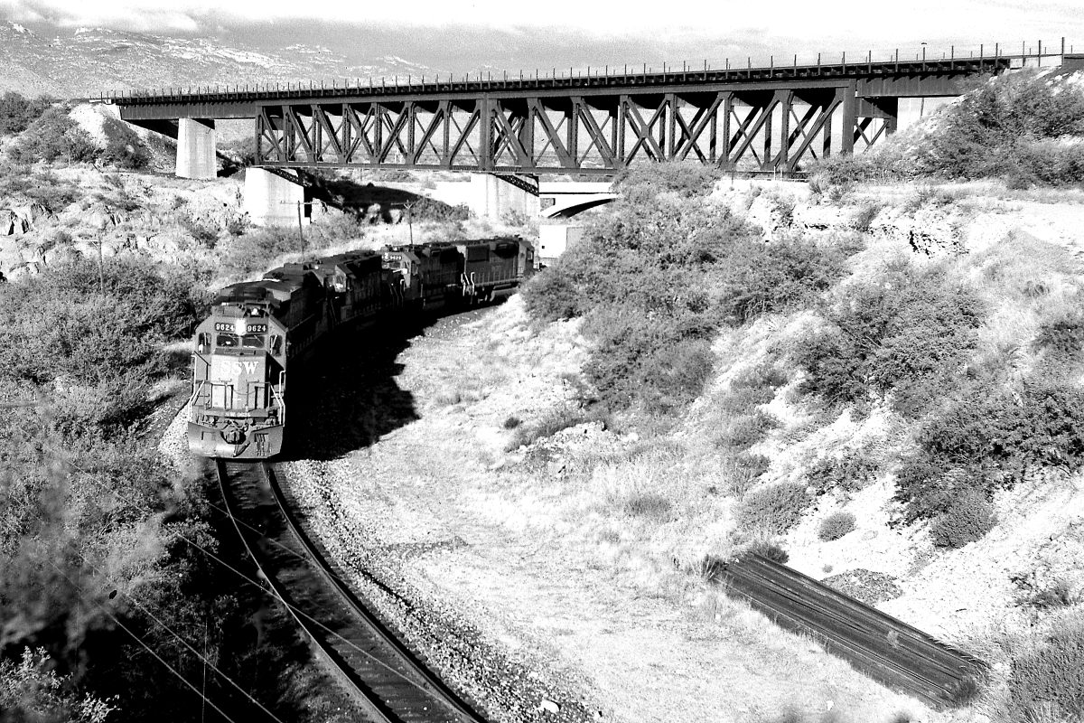 SSW 9624 is a class EMD GP60 and  is pictured in Vail, Arizona, USA.  This was taken along the Lordsburg/SP on the Southern Pacific Transportation Company. Photo Copyright: Rick Doughty uploaded to Railroad Gallery on 06/24/2024. This photograph of SSW 9624 was taken on Sunday, September 23, 1990. All Rights Reserved. 