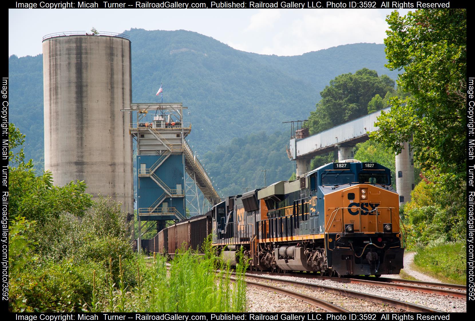 CSXT 1827 is a class ES44AC and  is pictured in Cumberland, Kentucky, United States.  This was taken along the Cumberland Valley Subdivision on the CSX Transportation. Photo Copyright: Micah  Turner uploaded to Railroad Gallery on 07/19/2024. This photograph of CSXT 1827 was taken on Monday, July 15, 2024. All Rights Reserved. 