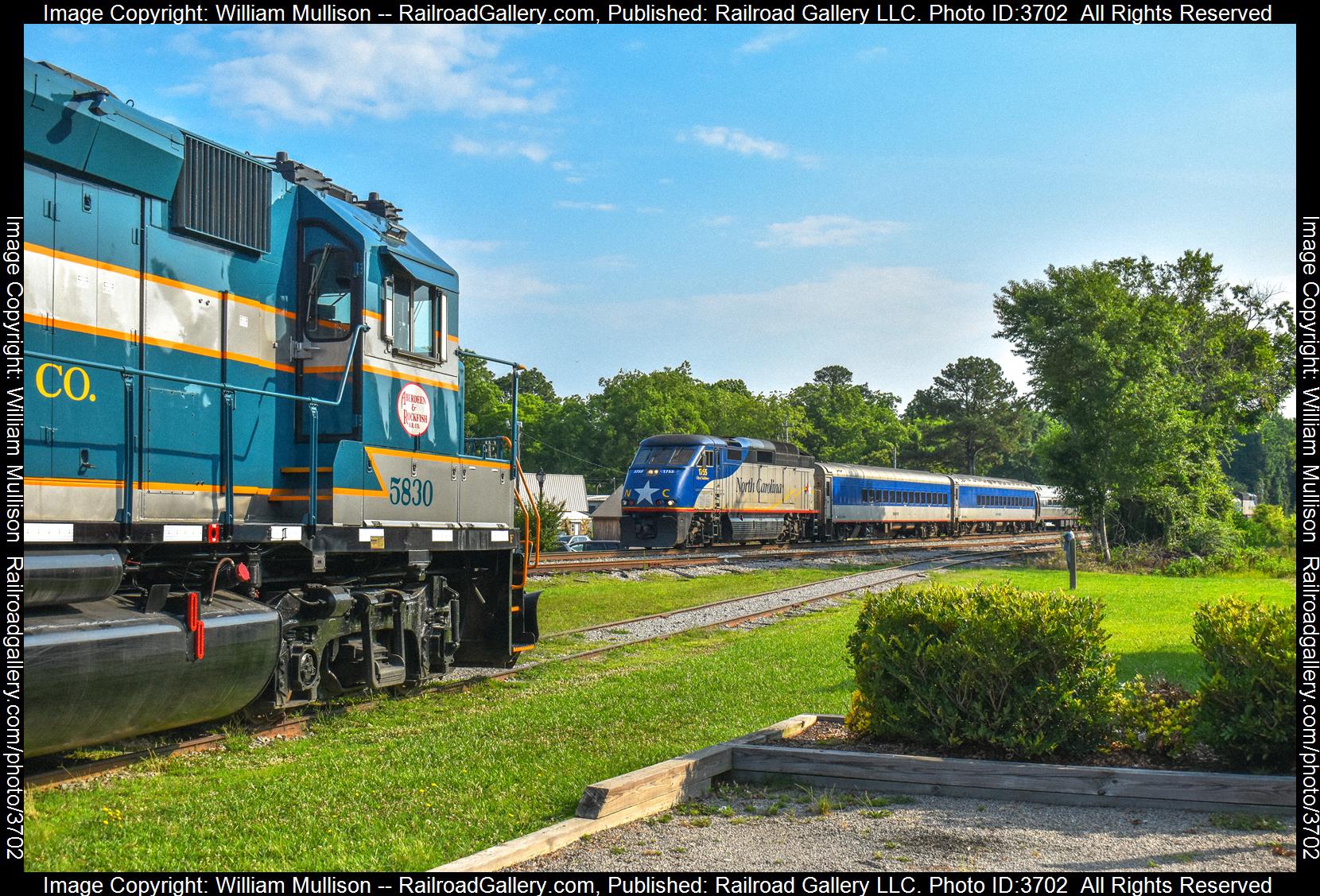 AR 5830, RNCX 1755 is a class GP38-3, F59PHI and  is pictured in Aberdeen, North Carolina, United States.  This was taken along the CSX Aberdeen Subdivison on the Amtrak. Photo Copyright: William Mullison uploaded to Railroad Gallery on 08/20/2024. This photograph of AR 5830, RNCX 1755 was taken on Sunday, June 16, 2024. All Rights Reserved. 