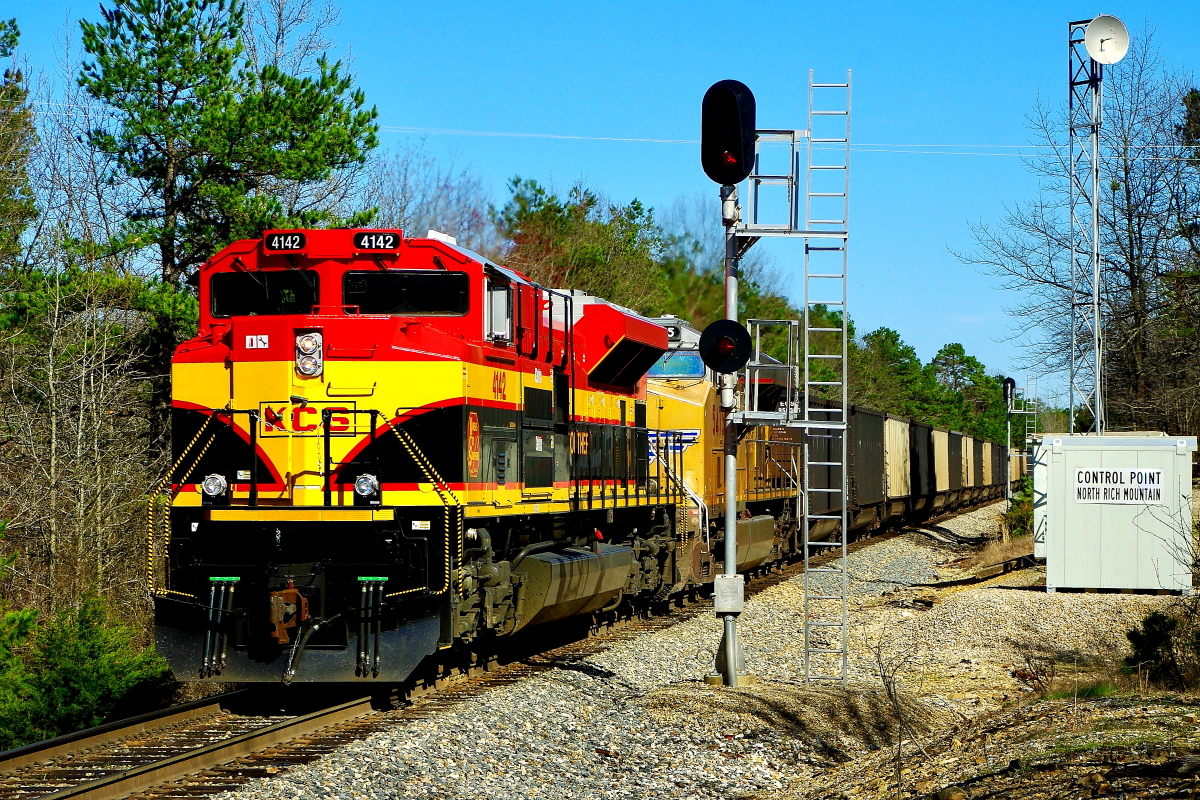 KCS 4142 is a class EMD SD70ACe and  is pictured in Rich Mountain, Arkansas, USA.  This was taken along the Shreveport/KCS on the Kansas City Southern Railway. Photo Copyright: Rick Doughty uploaded to Railroad Gallery on 08/21/2024. This photograph of KCS 4142 was taken on Friday, April 04, 2014. All Rights Reserved. 