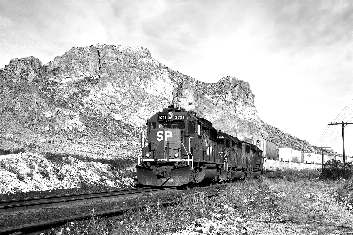 SP 9751 is a class EMD GP60 and  is pictured in Steins, New Mexico, USA.  This was taken along the Lordsburg/SP on the Southern Pacific Transportation Company. Photo Copyright: Rick Doughty uploaded to Railroad Gallery on 08/28/2024. This photograph of SP 9751 was taken on Sunday, February 13, 1994. All Rights Reserved. 