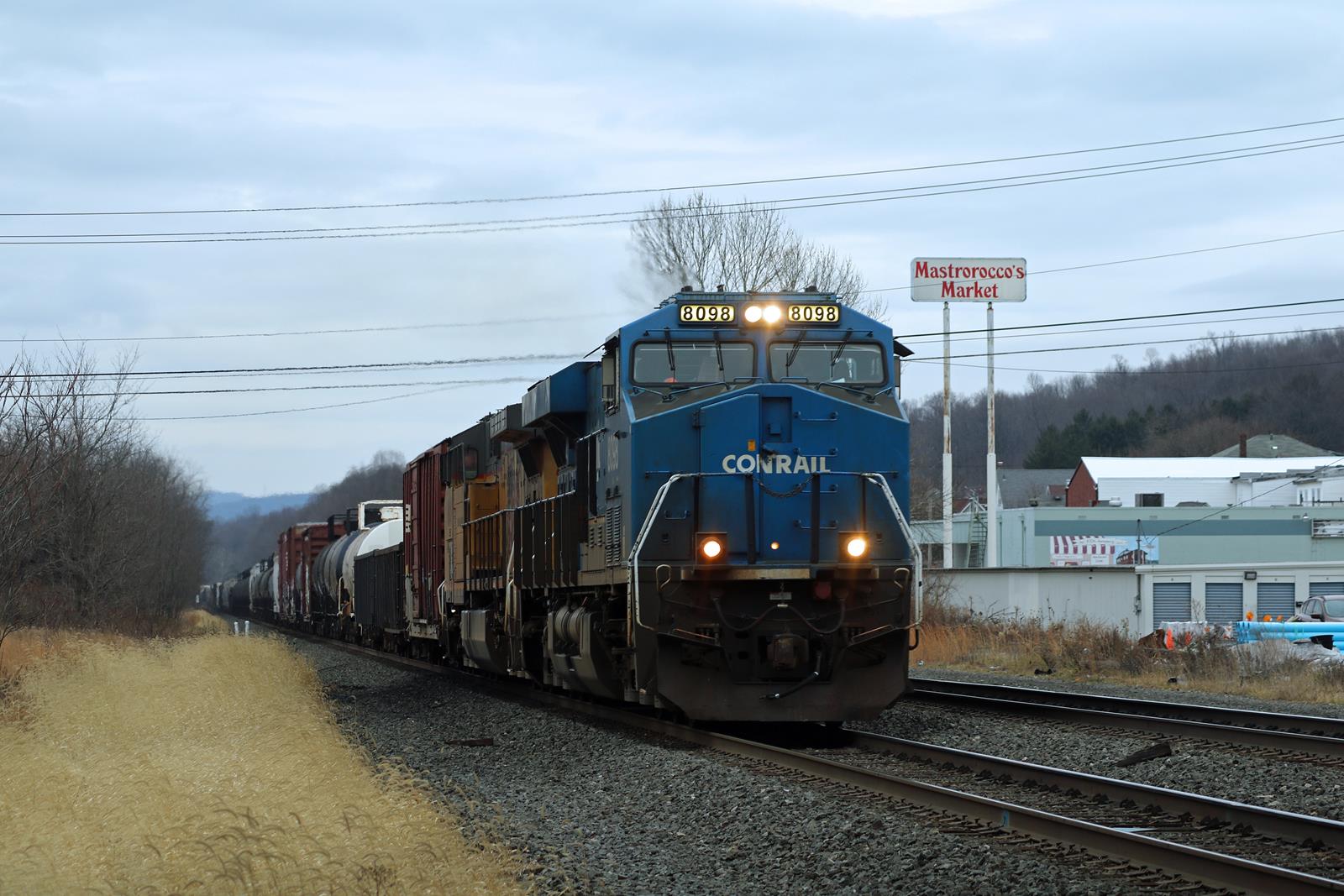 NS 8098 is a class GE ES44AC and  is pictured in Derry, Pennsylvania, United States.  This was taken along the Pittsburgh Line on the Norfolk Southern Railway. Photo Copyright: Adam Klimchock uploaded to Railroad Gallery on 12/11/2022. This photograph of NS 8098 was taken on Saturday, December 10, 2022. All Rights Reserved. 
