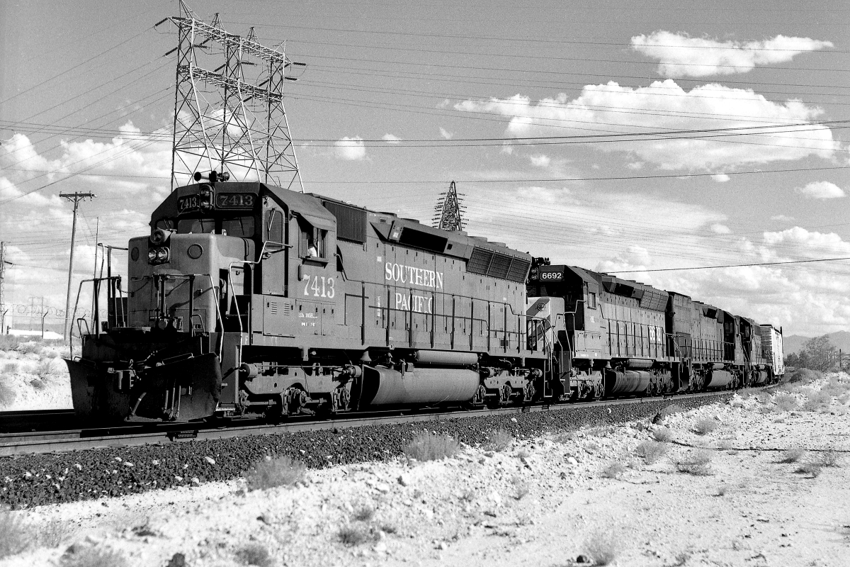 SP 7413 is a class EMD SD45 and  is pictured in Tucson, Arizona, USA.  This was taken along the Lordsburg/SP on the Southern Pacific Transportation Company. Photo Copyright: Rick Doughty uploaded to Railroad Gallery on 08/29/2024. This photograph of SP 7413 was taken on Friday, August 28, 1987. All Rights Reserved. 