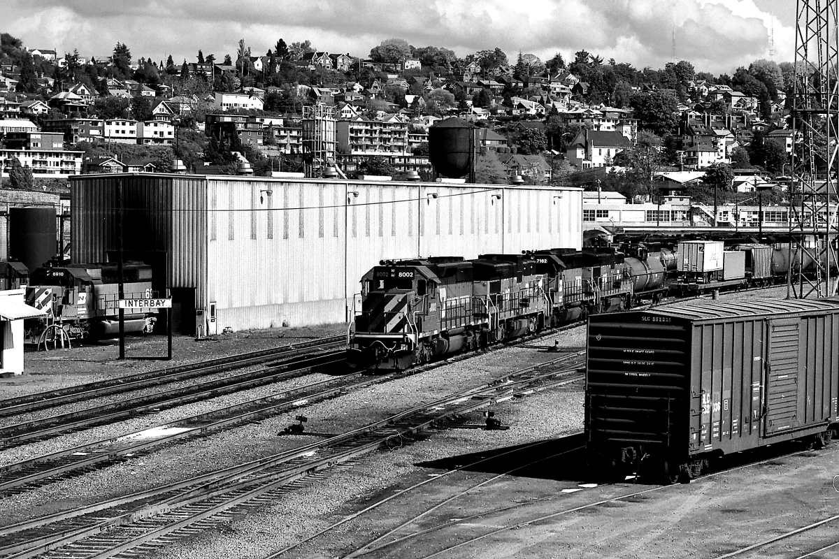 BN 8002 is a class EMD SD40-2 and  is pictured in Seattle, Washington, USA.  This was taken along the Scenic/BN on the Burlington Northern Railroad. Photo Copyright: Rick Doughty uploaded to Railroad Gallery on 08/31/2024. This photograph of BN 8002 was taken on Saturday, May 10, 1986. All Rights Reserved. 