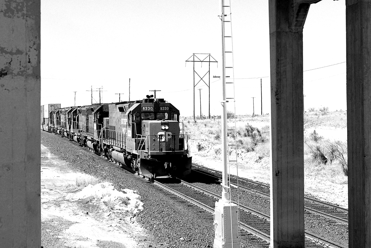 SP 8330 is a class EMD SD40T-2 and  is pictured in Mescal, Arizona, USA.  This was taken along the Lordsburg/SP on the Southern Pacific Transportation Company. Photo Copyright: Rick Doughty uploaded to Railroad Gallery on 09/02/2024. This photograph of SP 8330 was taken on Thursday, March 07, 1991. All Rights Reserved. 