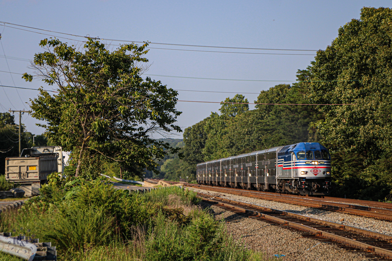 VRE V63 is a class MPI MP36PH-3C and  is pictured in Lorton, Virginia, USA.  This was taken along the RF&P Subdivision on the Virginia Railway Express. Photo Copyright: RF&P Productions uploaded to Railroad Gallery on 09/02/2024. This photograph of VRE V63 was taken on Tuesday, August 27, 2024. All Rights Reserved. 