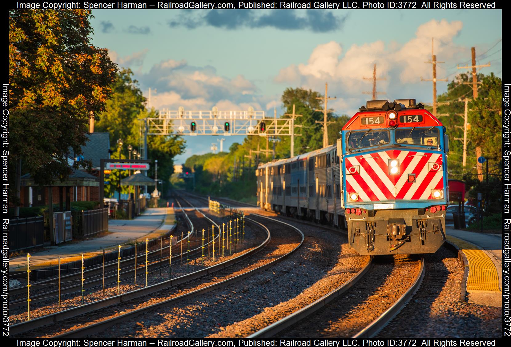 METX 154 is a class EMD F40PH and  is pictured in Glen Ellyn, Illinois, USA.  This was taken along the Geneva Subdivision on the Union Pacific Railroad. Photo Copyright: Spencer Harman uploaded to Railroad Gallery on 09/07/2024. This photograph of METX 154 was taken on Friday, September 06, 2024. All Rights Reserved. 