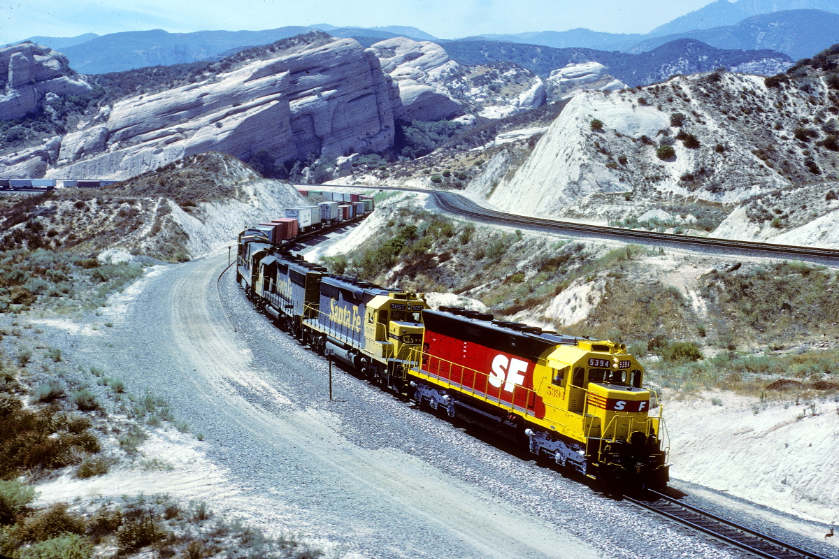 SF 5394 is a class EMD SD45 and  is pictured in Cajon, California, USA.  This was taken along the Cajon/SF on the Santa Fe. Photo Copyright: Rick Doughty uploaded to Railroad Gallery on 09/17/2024. This photograph of SF 5394 was taken on Saturday, September 07, 1985. All Rights Reserved. 