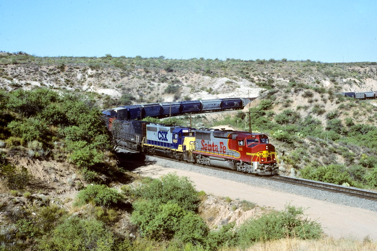 SF 141 is a class EMD GP60M and  is pictured in Vail, Arizona, USA.  This was taken along the Lordsburg/SP on the Santa Fe. Photo Copyright: Rick Doughty uploaded to Railroad Gallery on 09/23/2024. This photograph of SF 141 was taken on Tuesday, July 04, 1995. All Rights Reserved. 