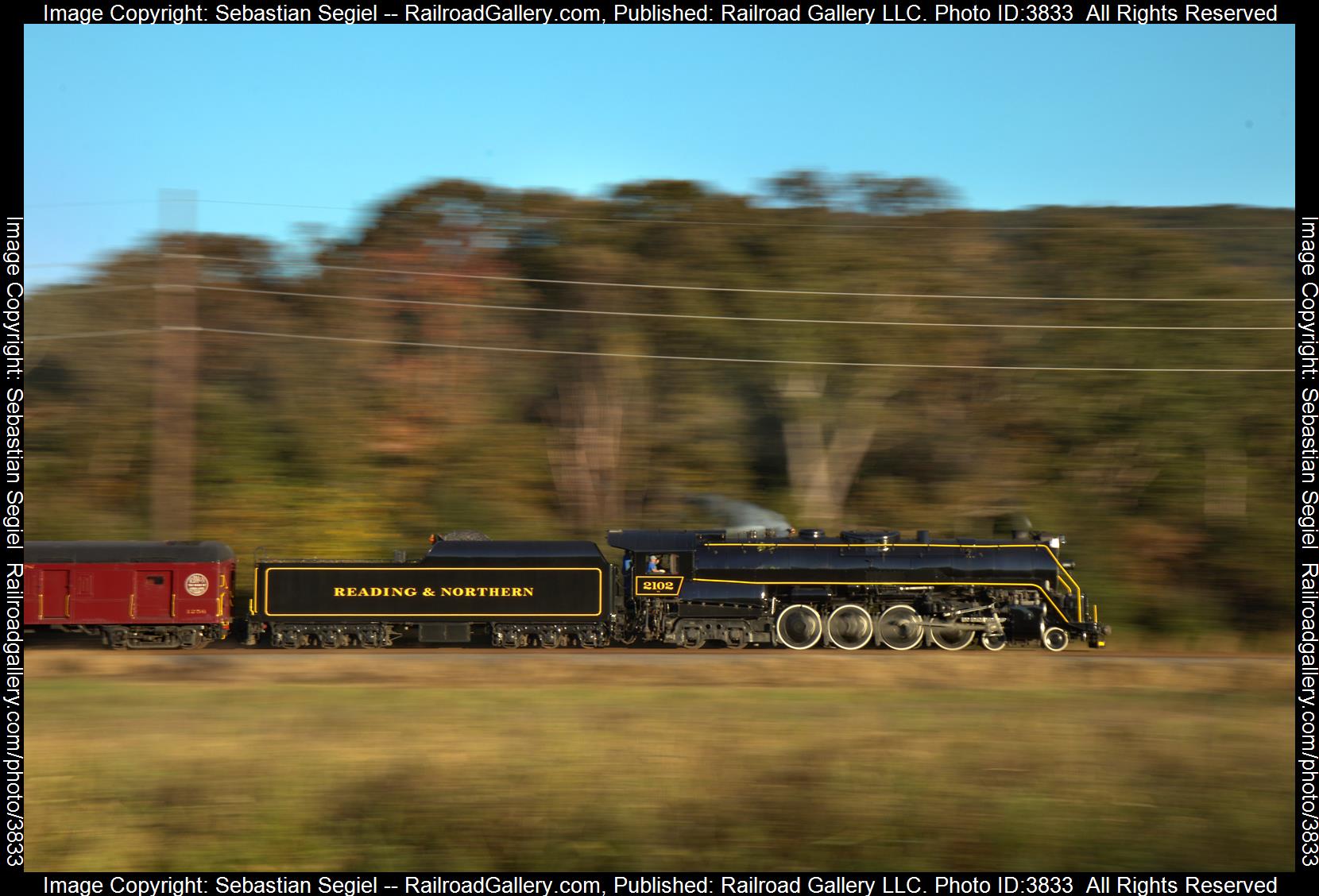 2102 is a class 4-8-4 and  is pictured in Drehersville , PA, United States.  This was taken along the Millers Crossing Road on the Reading Blue Mountain and Northern Railroad. Photo Copyright: Sebastian Segiel uploaded to Railroad Gallery on 10/07/2024. This photograph of 2102 was taken on Saturday, October 05, 2024. All Rights Reserved. 