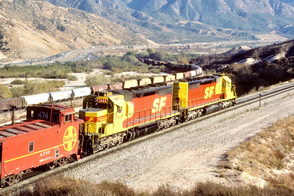 SF 1564 is a class EMD SD39 and  is pictured in Cajon, California, USA.  This was taken along the Cajon/SF on the Santa Fe. Photo Copyright: Rick Doughty uploaded to Railroad Gallery on 10/09/2024. This photograph of SF 1564 was taken on Wednesday, November 13, 1985. All Rights Reserved. 