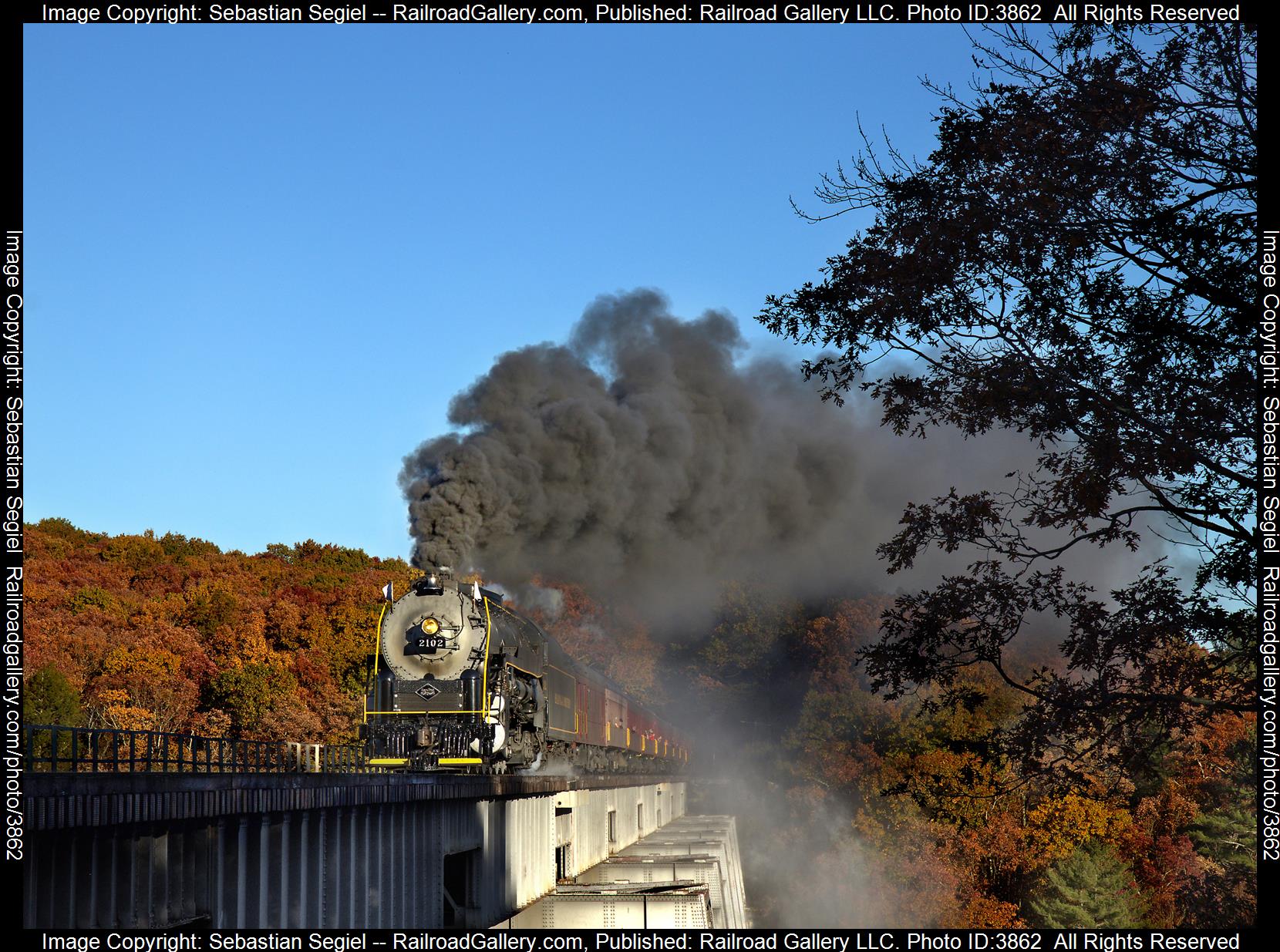 2102  is a class 4-8-4 and  is pictured in Hometown, PA, United States.  This was taken along the Hometown High Bridge on the Reading Blue Mountain and Northern Railroad. Photo Copyright: Sebastian Segiel uploaded to Railroad Gallery on 10/21/2024. This photograph of 2102  was taken on Saturday, October 19, 2024. All Rights Reserved. 