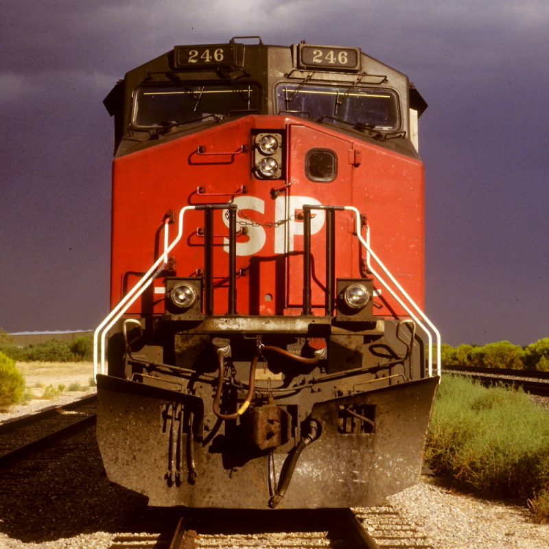 SP 246 is a class GE AC4400CW and  is pictured in Tucson, Arizona, USA.  This was taken along the Lordsburg/SP on the Southern Pacific Transportation Company. Photo Copyright: Rick Doughty uploaded to Railroad Gallery on 11/19/2024. This photograph of SP 246 was taken on Thursday, August 11, 1988. All Rights Reserved. 