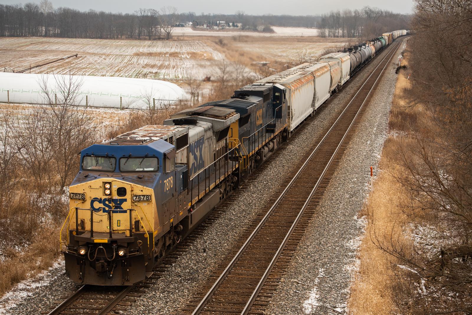 CSXT 7878 is a class GE C40-8W (Dash 8-40CW) and  is pictured in Albion, Indiana, United States.  This was taken along the Garrett Subdivision on the CSX Transportation. Photo Copyright: Spencer Harman uploaded to Railroad Gallery on 12/19/2022. This photograph of CSXT 7878 was taken on Monday, December 19, 2022. All Rights Reserved. 