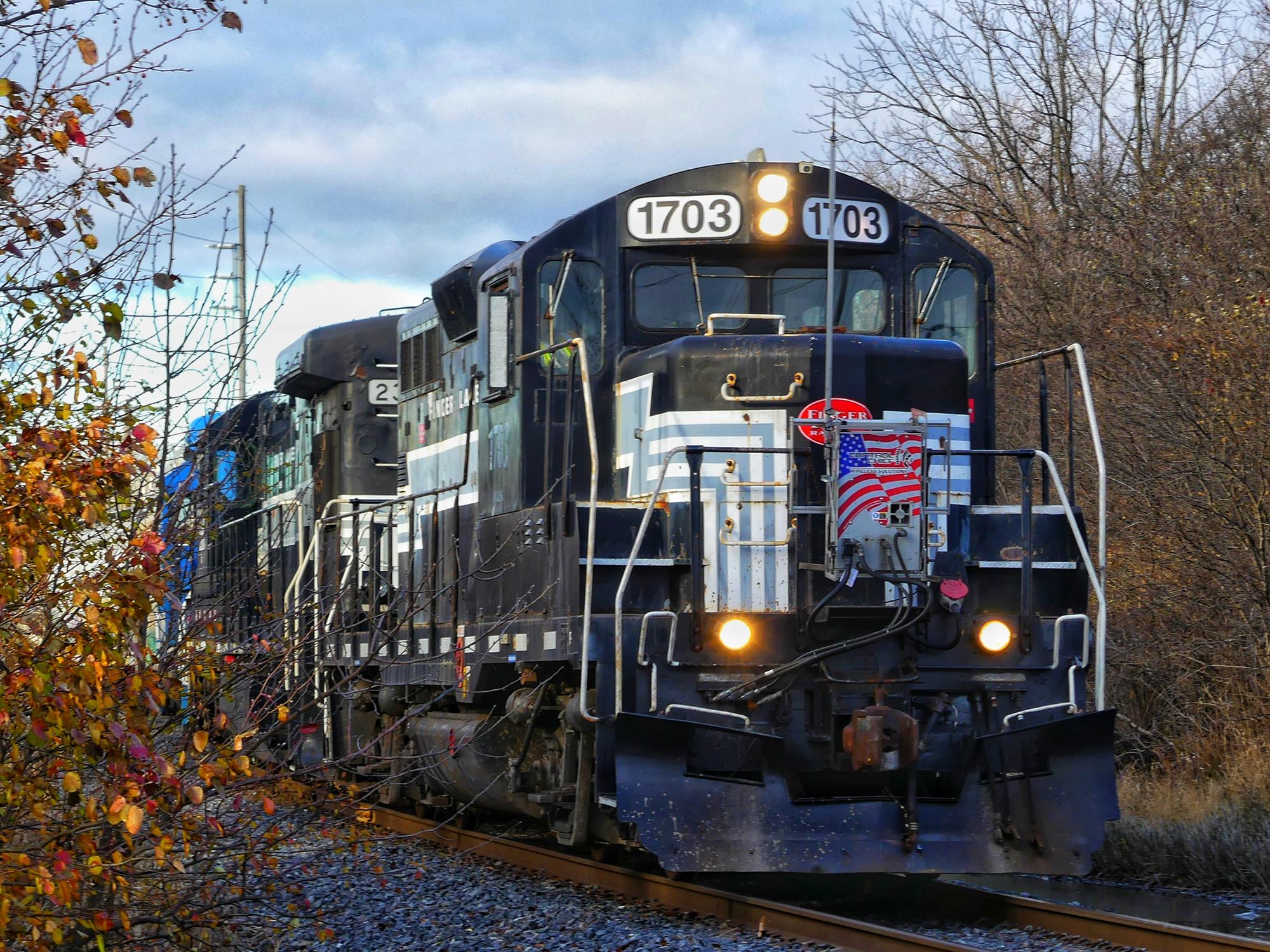 FGLK 1703 is a class EMD GP9 and  is pictured in Canandaigua , New York , USA.  This was taken along the Canandaigua Branch on the Finger Lakes Railway. Photo Copyright: Scott  Murnan  uploaded to Railroad Gallery on 12/27/2022. This photograph of FGLK 1703 was taken on Thursday, December 01, 2022. All Rights Reserved. 