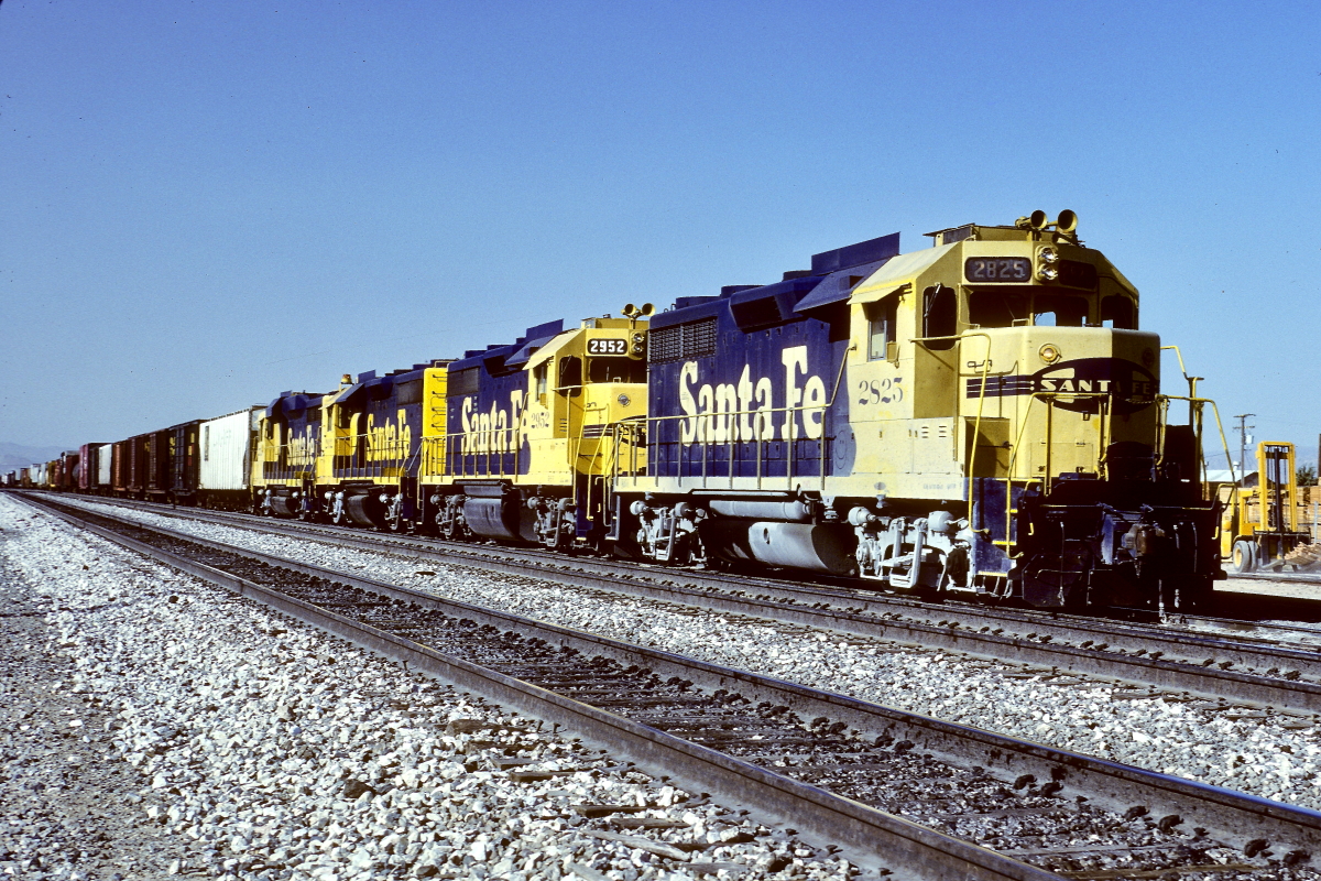 SF 2825 is a class EMD GP35 and  is pictured in Hesperia, California, USA.  This was taken along the Cajon/SF on the Santa Fe. Photo Copyright: Rick Doughty uploaded to Railroad Gallery on 12/14/2024. This photograph of SF 2825 was taken on Friday, April 26, 1985. All Rights Reserved. 