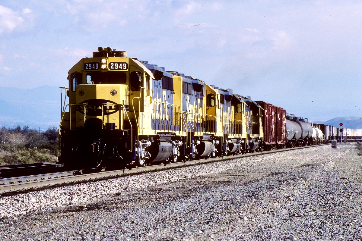 SF 2949 is a class EMD GP35 and  is pictured in Devore, California, USA.  This was taken along the Cajon/SF on the Santa Fe. Photo Copyright: Rick Doughty uploaded to Railroad Gallery on 12/14/2024. This photograph of SF 2949 was taken on Friday, December 20, 1985. All Rights Reserved. 