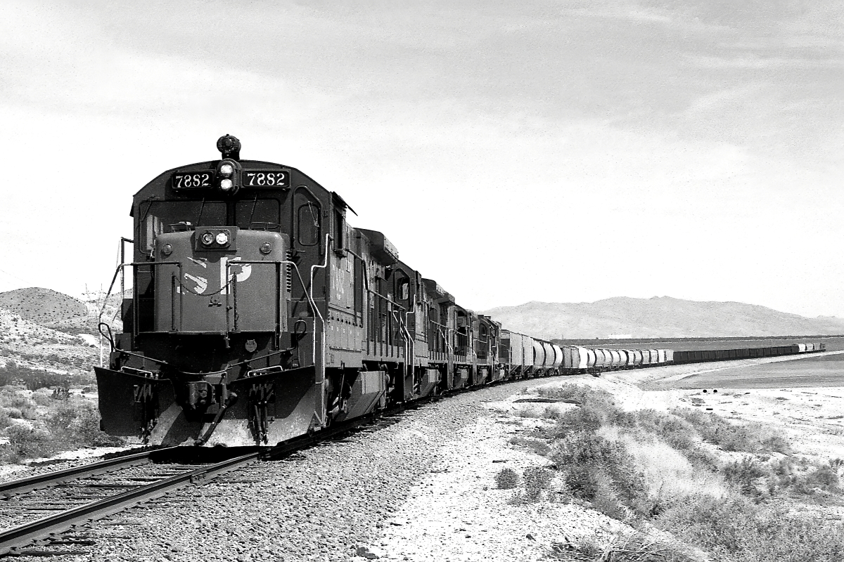 SP 7882 is a class GE B30-7 and  is pictured in Cantil, California, USA.  This was taken along the Owenyo Branch/SP on the Southern Pacific Transportation Company. Photo Copyright: Rick Doughty uploaded to Railroad Gallery on 12/21/2024. This photograph of SP 7882 was taken on Saturday, April 03, 1982. All Rights Reserved. 