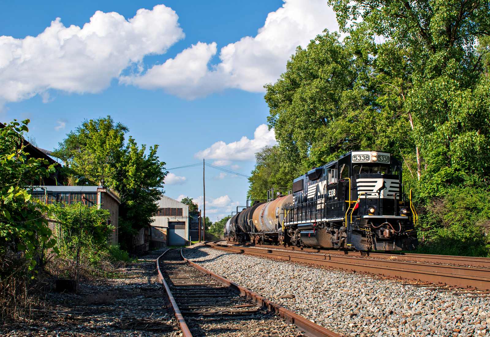 NS 5338 is a class EMD GP38-2 and  is pictured in Lockland, Ohio, United States.  This was taken along the Dayton District on the Norfolk Southern. Photo Copyright: David Rohdenburg uploaded to Railroad Gallery on 01/01/2023. This photograph of NS 5338 was taken on Monday, August 02, 2021. All Rights Reserved. 