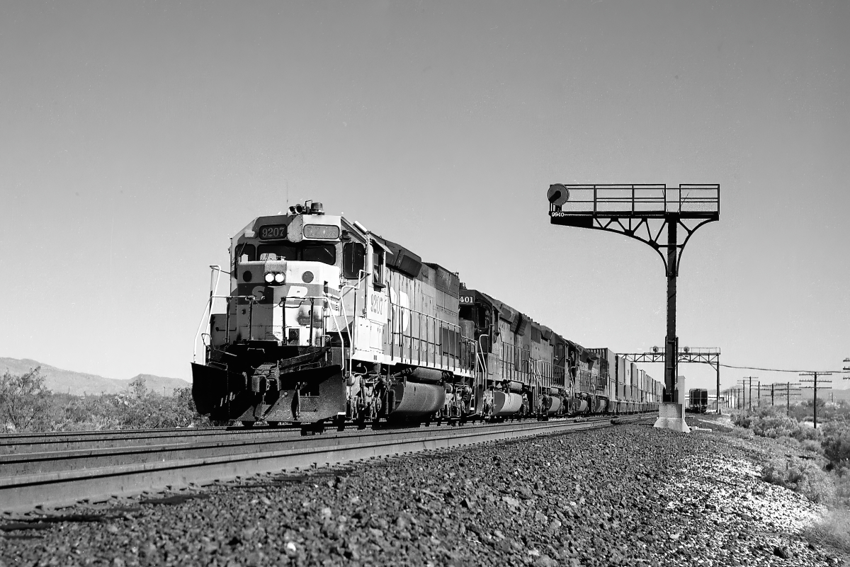 SP 9207 is a class EMD SD45T-2 and  is pictured in Tucson, Arizona, USA.  This was taken along the Lordsburg/SP on the Southern Pacific Transportation Company. Photo Copyright: Rick Doughty uploaded to Railroad Gallery on 01/28/2025. This photograph of SP 9207 was taken on Friday, October 05, 1990. All Rights Reserved. 