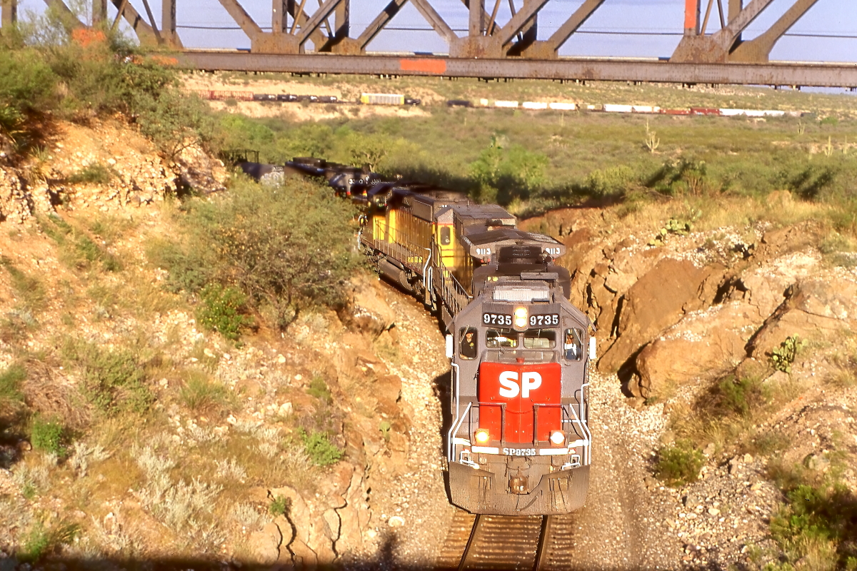 SP 9735 is a class EMD GP60 and  is pictured in Vail, Arizona, USA.  This was taken along the Lordsburg/UP on the Southern Pacific Transportation Company. Photo Copyright: Rick Doughty uploaded to Railroad Gallery on 02/08/2025. This photograph of SP 9735 was taken on Saturday, September 23, 2000. All Rights Reserved. 