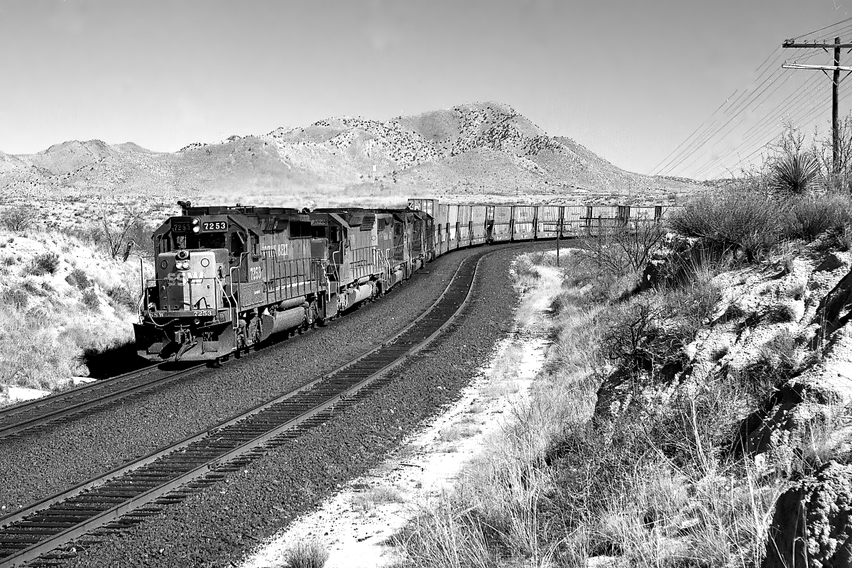 SSW 7253 is a class EMD GP40-2 and  is pictured in Benson, Arizona, USA.  This was taken along the Lordsburg/SP on the Southern Pacific Transportation Company. Photo Copyright: Rick Doughty uploaded to Railroad Gallery on 03/06/2025. This photograph of SSW 7253 was taken on Wednesday, March 15, 1995. All Rights Reserved. 