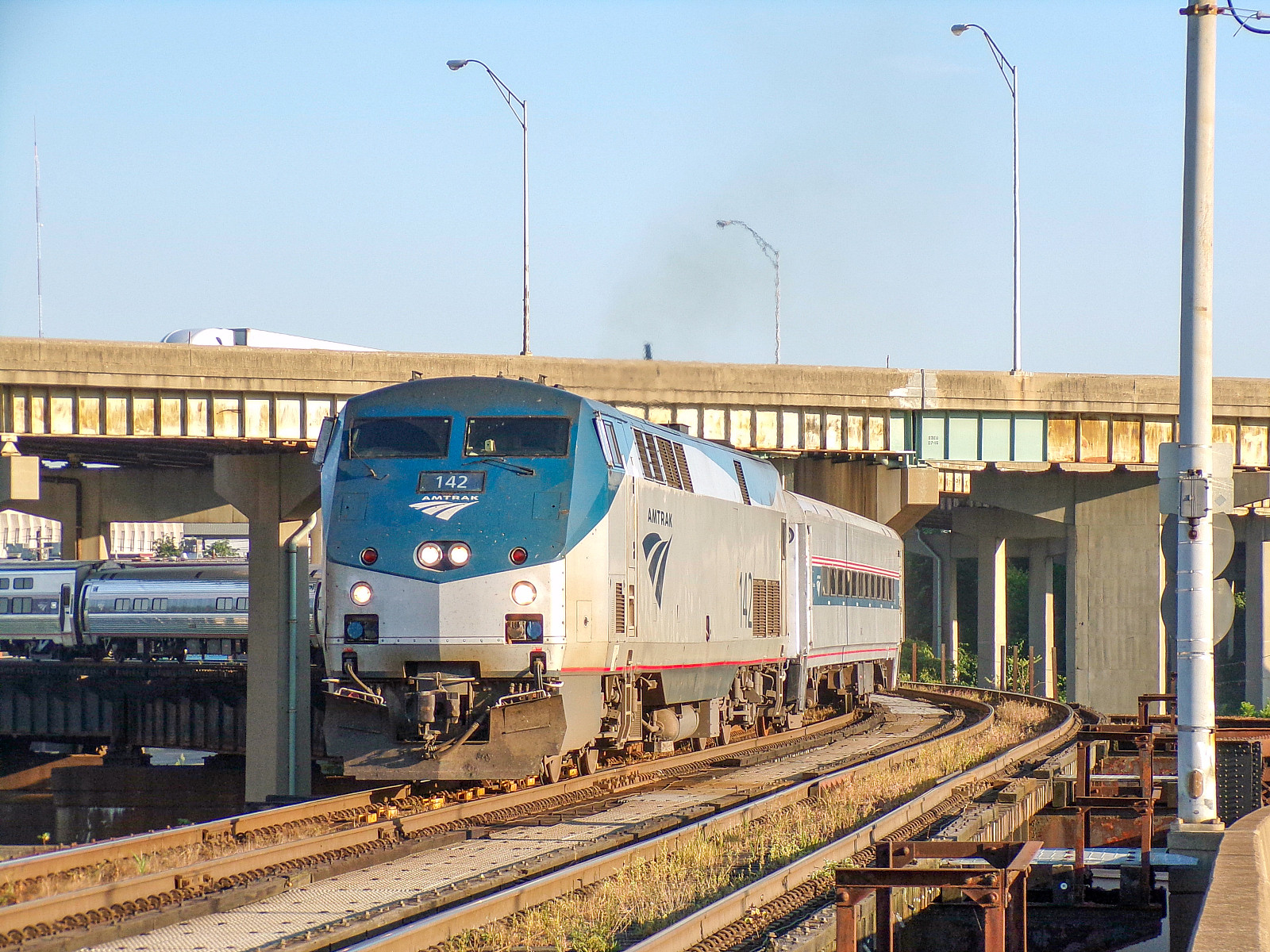 AMTK 142 is a class GE P42DC and  is pictured in Cincinnati, OH, United States.  This was taken along the CSX Cincinnati Terminal Subdivision on the Amtrak. Photo Copyright: David Rohdenburg uploaded to Railroad Gallery on 01/14/2023. This photograph of AMTK 142 was taken on Sunday, August 11, 2019. All Rights Reserved. 