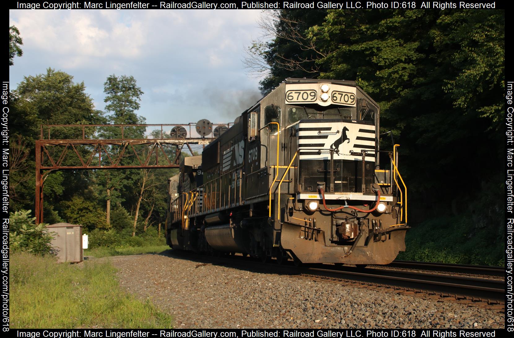 NS 6709 is a class EMD SD60 and  is pictured in Tyrone, Pennsylvania, USA.  This was taken along the NS Pittsburgh Line on the Norfolk Southern. Photo Copyright: Marc Lingenfelter uploaded to Railroad Gallery on 01/24/2023. This photograph of NS 6709 was taken on Thursday, July 26, 2018. All Rights Reserved. 