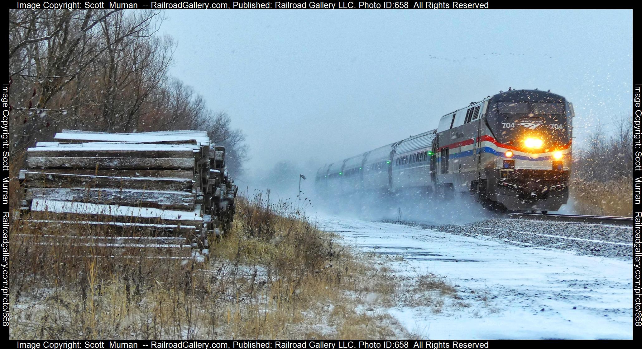 AMTK 704 is a class GE P32ACDM and  is pictured in Macedon, New York, USA.  This was taken along the Rochester  on the CSX Transportation. Photo Copyright: Scott  Murnan  uploaded to Railroad Gallery on 02/01/2023. This photograph of AMTK 704 was taken on Monday, January 30, 2023. All Rights Reserved. 