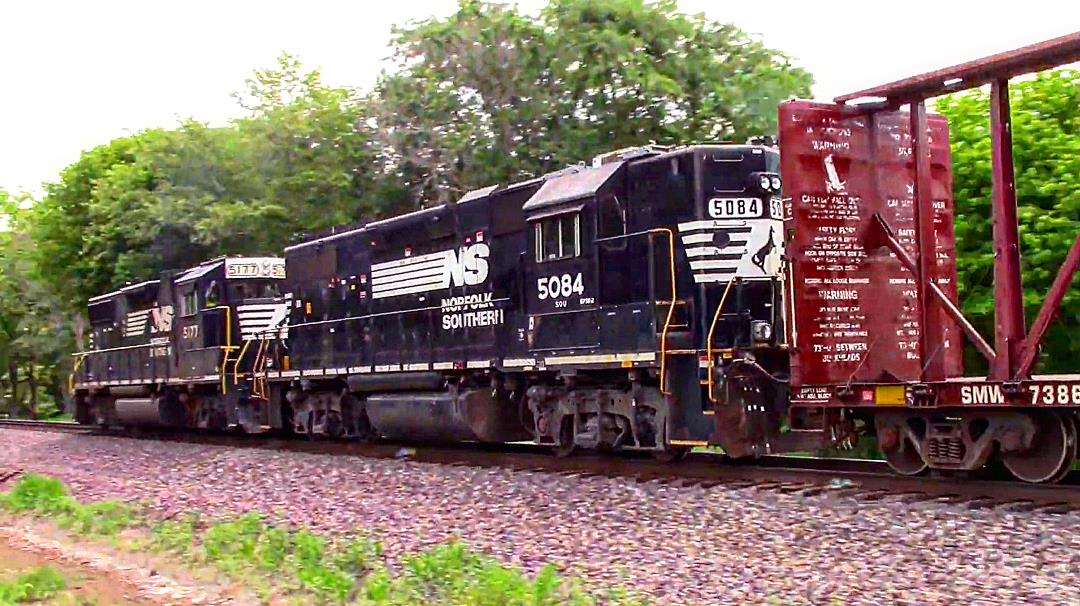 NS 5084 is a class EMD GP38-2 and  is pictured in Mount Vernon, Illinois, USA.  This was taken along the NS Southern West district on the Norfolk Southern. Photo Copyright: Blaise Lambert uploaded to Railroad Gallery on 03/07/2023. This photograph of NS 5084 was taken on Friday, July 09, 2021. All Rights Reserved. 