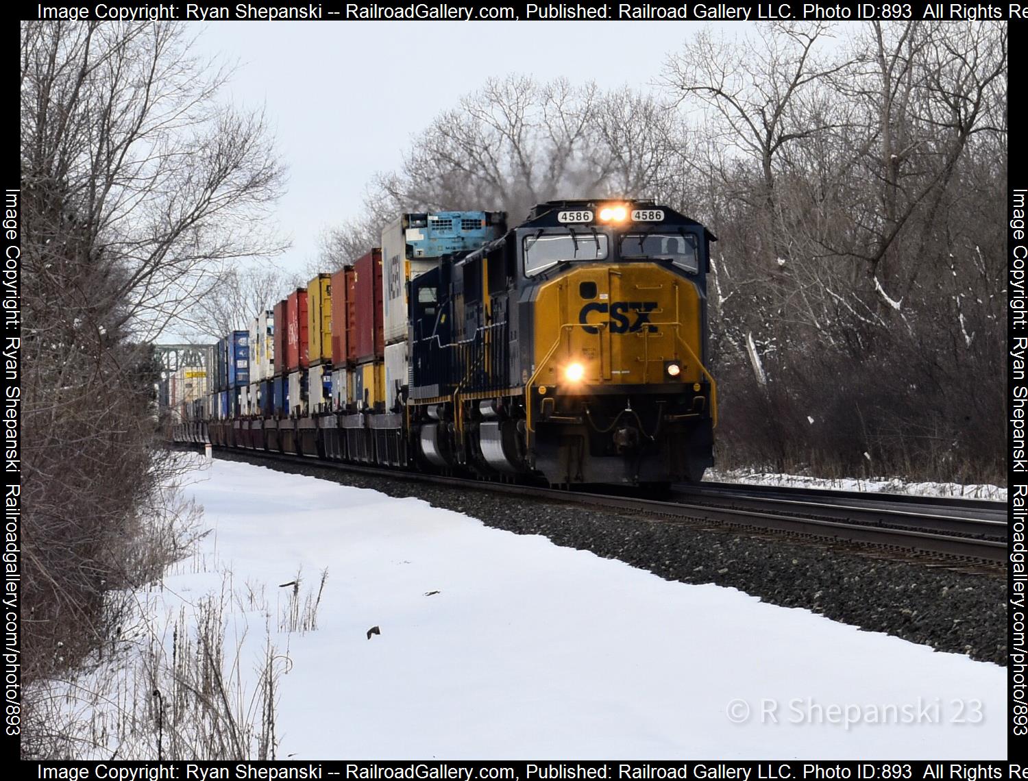 CSXT 4586 is a class SD70MACE and  is pictured in Churchville, NY, United States.  This was taken along the Rochester sub on the CSX Transportation. Photo Copyright: Ryan Shepanski uploaded to Railroad Gallery on 03/27/2023. This photograph of CSXT 4586 was taken on Sunday, March 12, 2023. All Rights Reserved. 