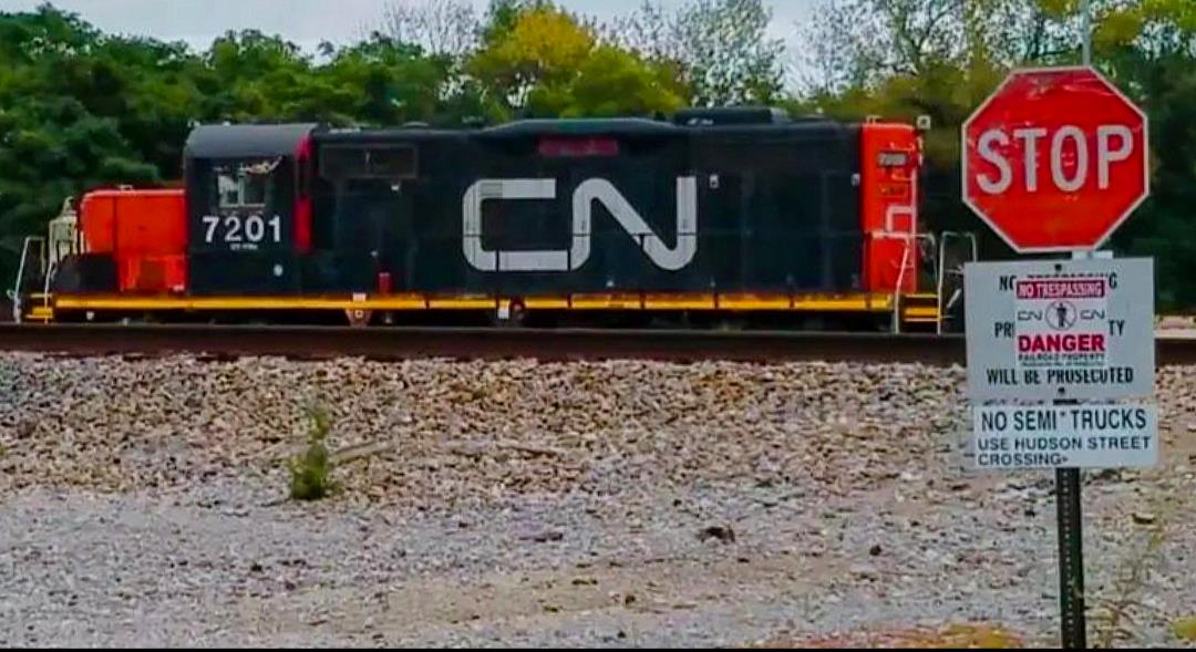 CN 7201 is a class EMD GP9R and  is pictured in Centralia, Illinois, USA.  This was taken along the CN Centralia subdivision on the Canadian National Railway. Photo Copyright: Blaise Lambert uploaded to Railroad Gallery on 04/15/2023. This photograph of CN 7201 was taken on Saturday, September 01, 2018. All Rights Reserved. 