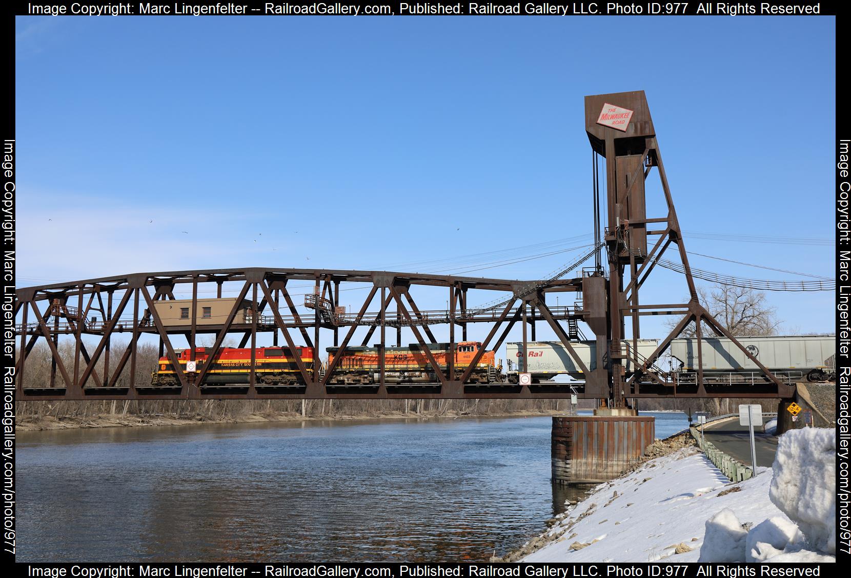 KCS 3912 is a class EMD SD70MAC and  is pictured in Hastings, Minnesota, USA.  This was taken along the CP River Sub on the Kansas City Southern Railway. Photo Copyright: Marc Lingenfelter uploaded to Railroad Gallery on 04/19/2023. This photograph of KCS 3912 was taken on Monday, March 20, 2023. All Rights Reserved. 