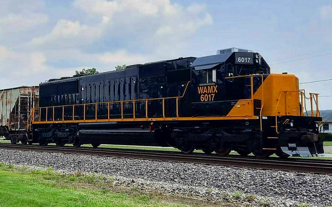 WAMX 6017 is a class EMD SD60 and  is pictured in Woodlawn, Illinois, USA.  This was taken along the EVWR Evansville District on the Web Asset Management. Photo Copyright: Blaise Lambert uploaded to Railroad Gallery on 04/22/2023. This photograph of WAMX 6017 was taken on Wednesday, July 21, 2021. All Rights Reserved. 
